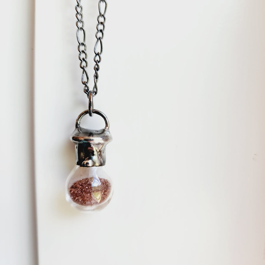 Glass Bottle Necklace filled with Copper Shavings